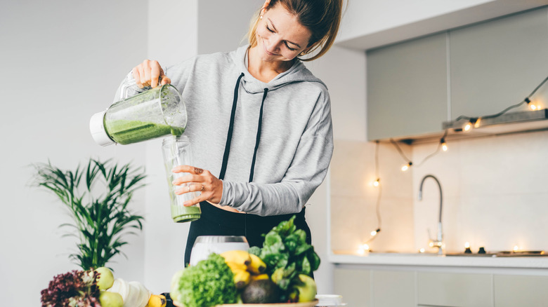 Woman making a smoothie