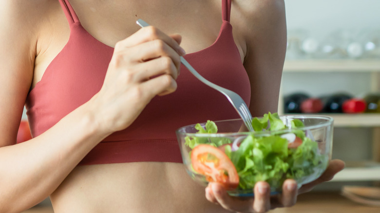 woman eating salad