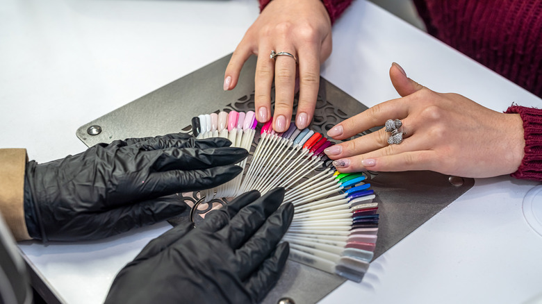 woman picking out nail color