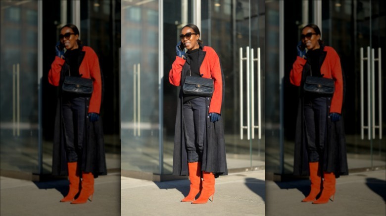 Unidentified individual wearing blue leather gloves