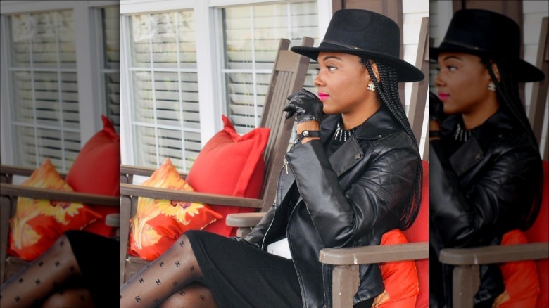 Woman wearing faux leather gloves