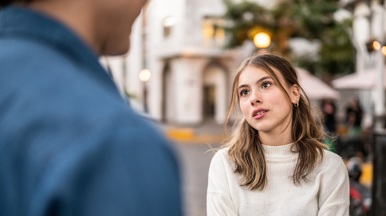woman talking to partner outside