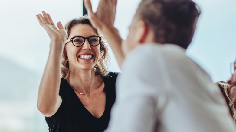 colleagues high-fiving