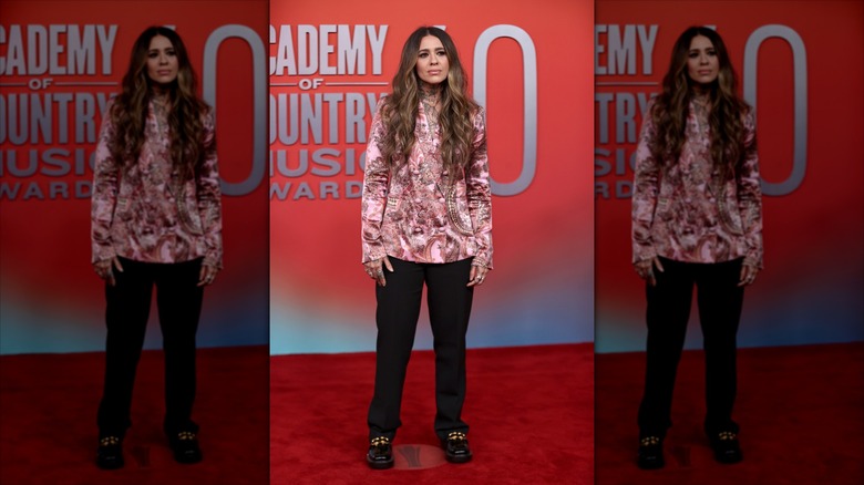 Morgan Wade on the red carpet at the 2025 ACM Awards in a pink blazer