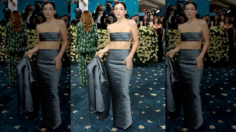 Lorde wearing a silvery crop top outfit at the 2025 Met Gala