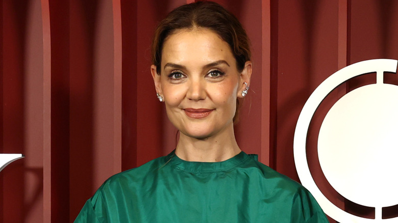 Katie Holmes poses at the Tony Awards in a green top