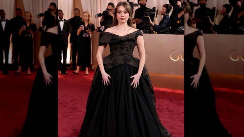 Aimee Lou Wood poses for photos at the Golden Globes