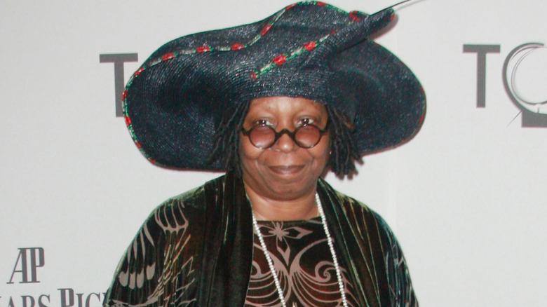 Whoopi Goldberg wearing a big hat