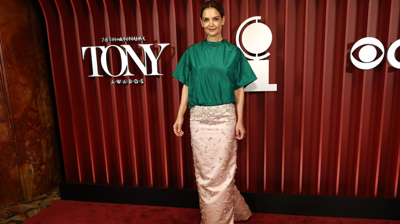Katie Holmes in a green shirt and pink skirt at the 2025 Tony Awards
