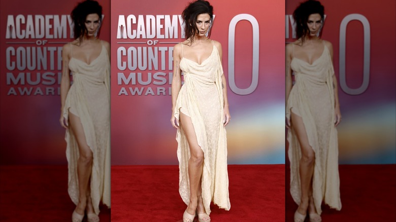 Kassi Ashton wearing a low-effort pale dress at the May 2025 ACMs