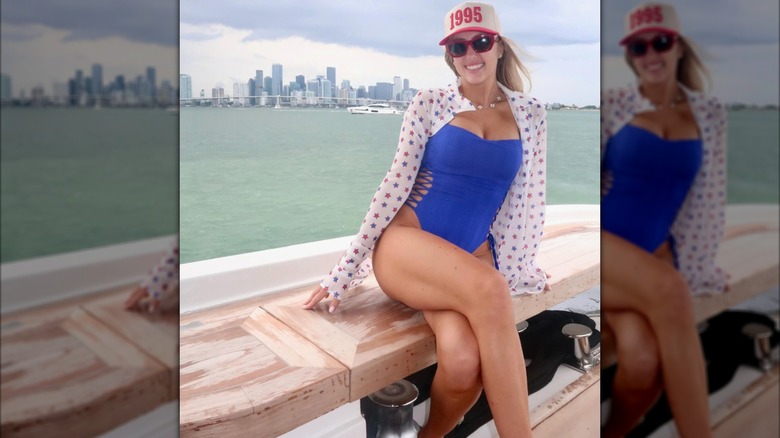 Brittany Mahones poses on a boat overlooking the skyline