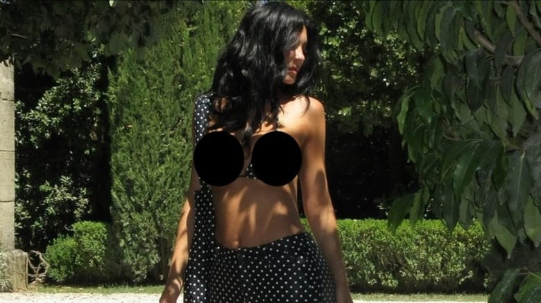 Kylie Jenner wears a polka-dot bikini top and capri pants