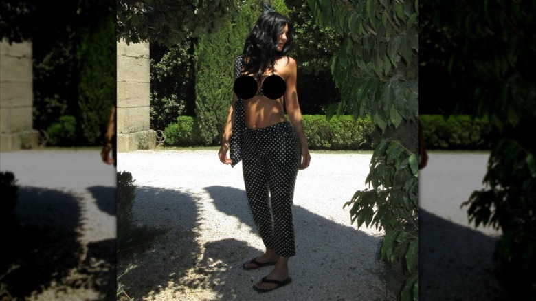 Kylie Jenner wears a polka-dot bikini top and capri pants