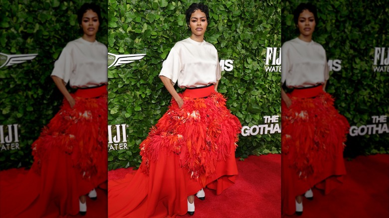 Teyana Taylor wearing a white top with a red skirt at the 2025 Gotham Awards