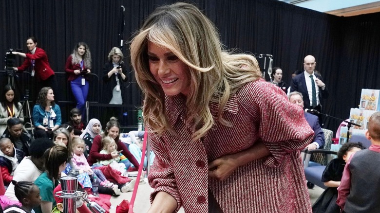 Melania Trump greeting children.