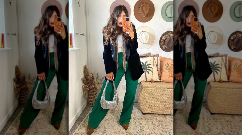 a woman wearing a skinny scarf with tassels