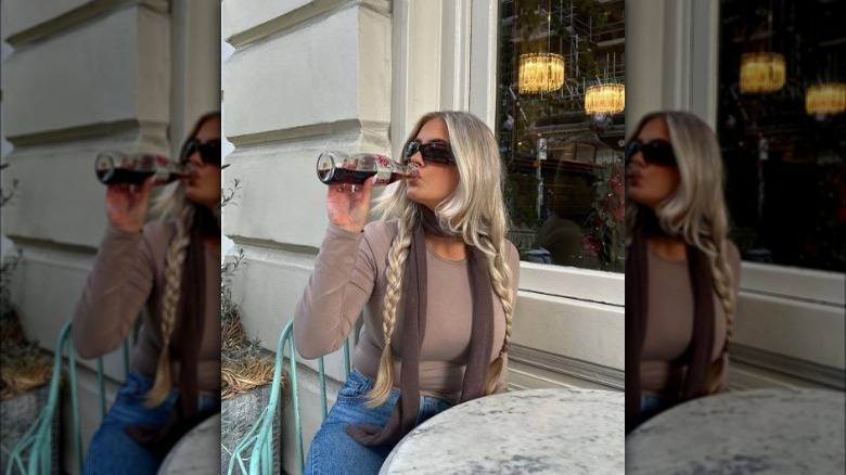 a woman wearing a brown skinny scarf