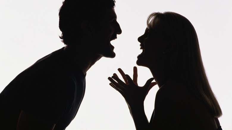 Man and woman fighting