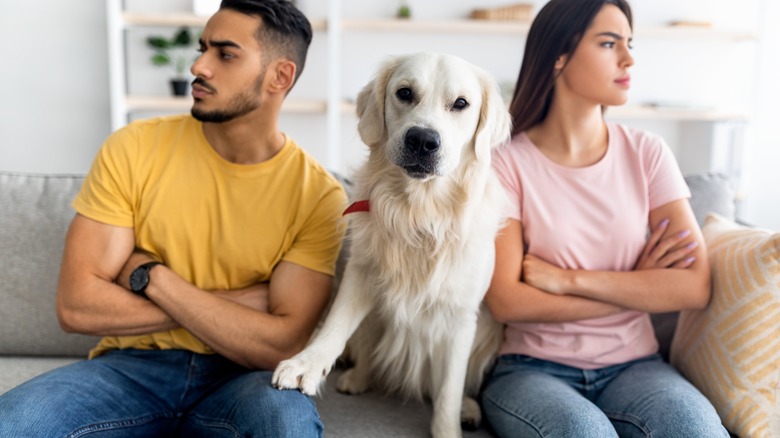 Two people and a dog