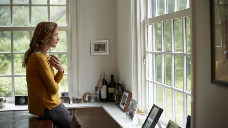 Woman looking out the window