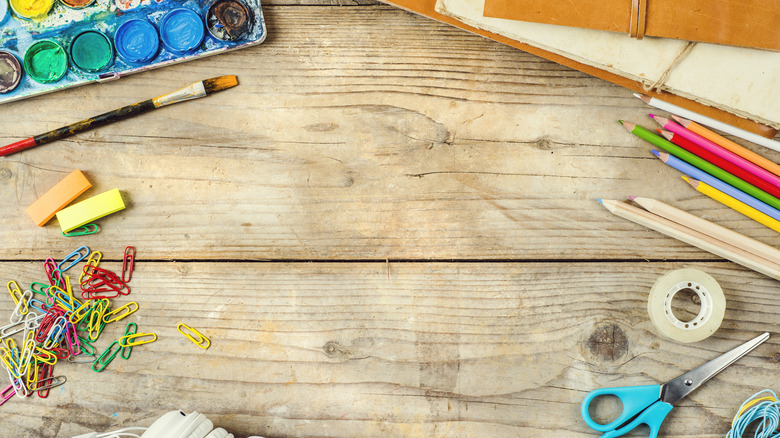 Art supplies spread on table