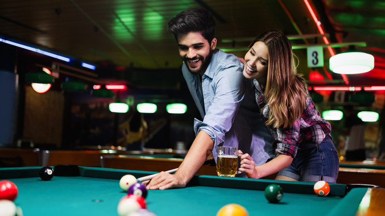 Couple playing pool