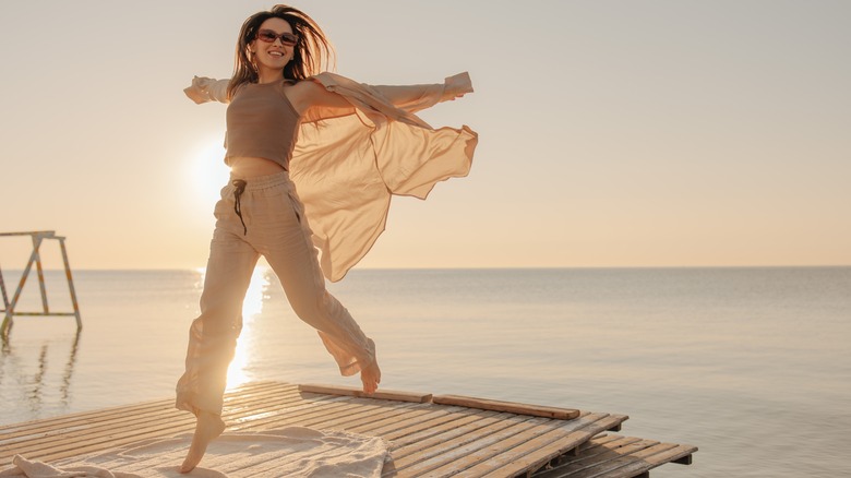 Person leaping in sunshine