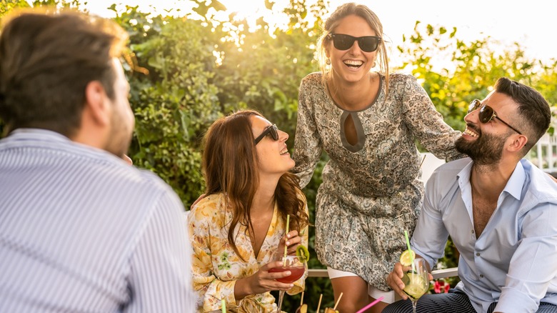 Friends talking outside party