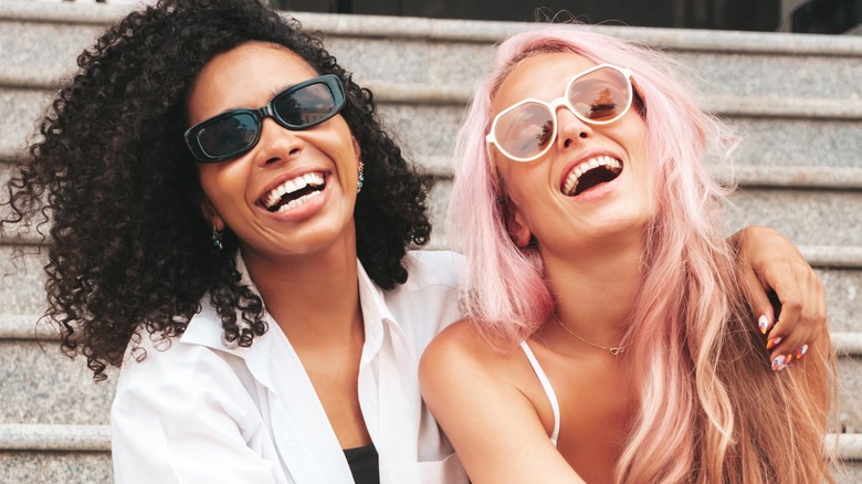 Laughing young lesbian couple