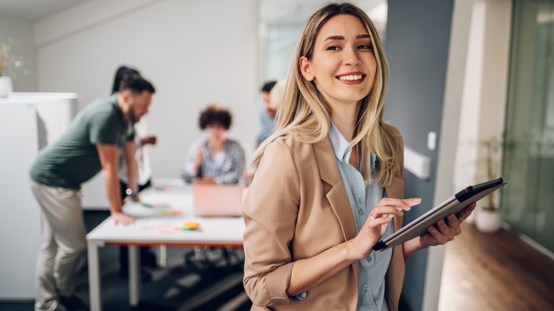 Woman boss holding tablet