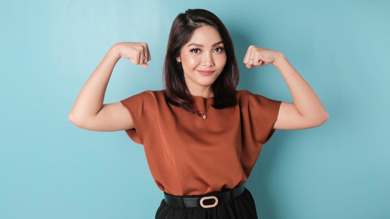 woman flexing muscles