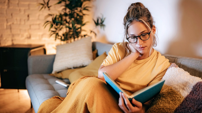 Woman reading on couch
