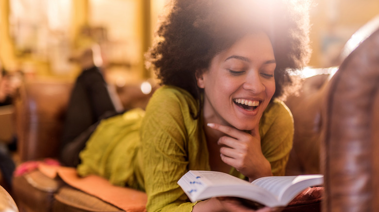Woman reading on couch