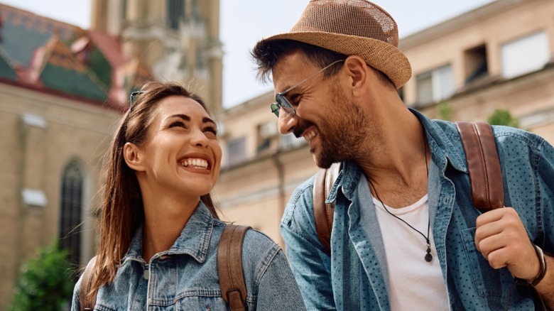 A couple smiling at each other