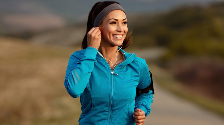 woman running while listening to music