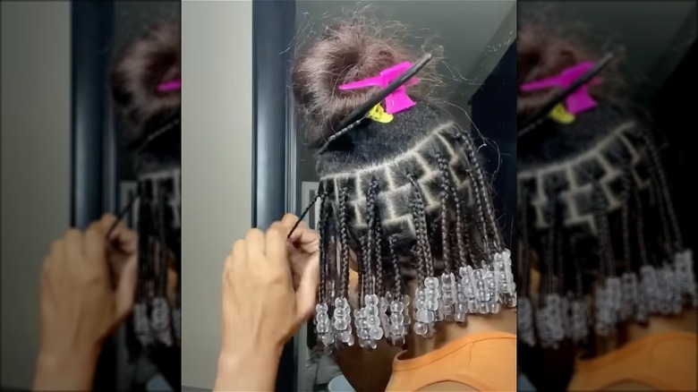 woman with short beaded braids