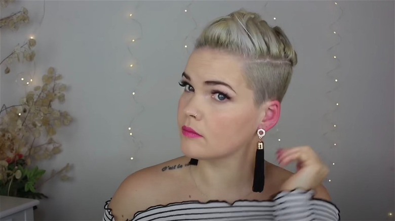 woman with french braided pixie cut