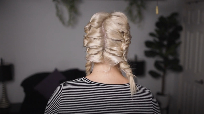 woman with short hair in two braids