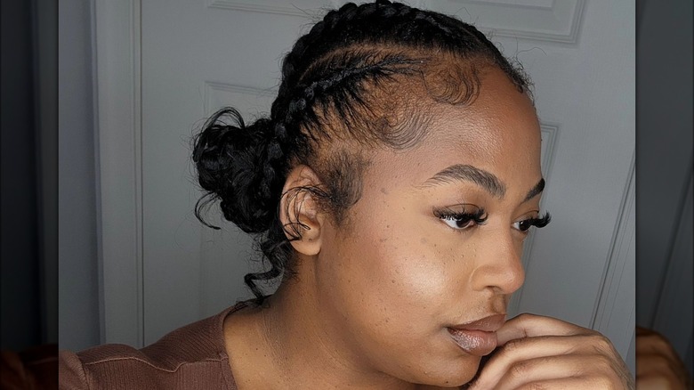 woman wearing braids pulled into bun