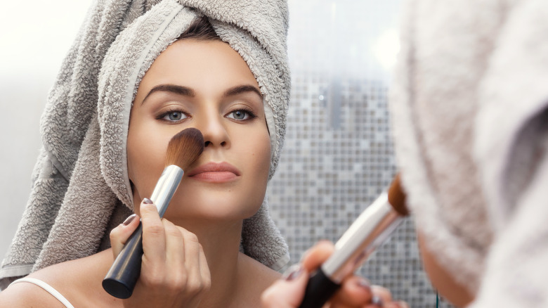 woman applying powder