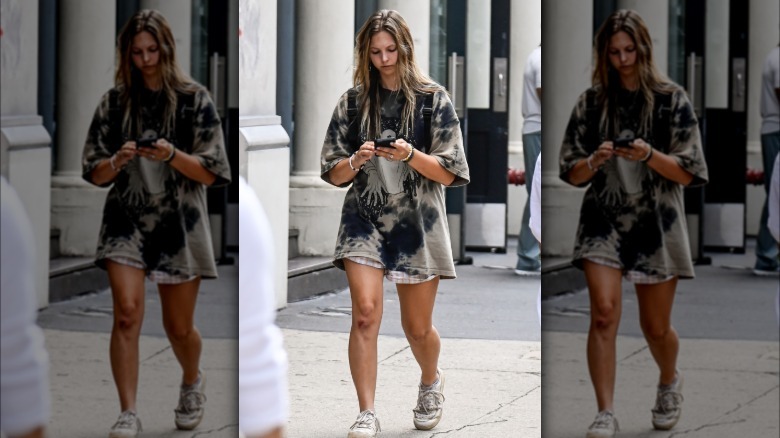 Person in tie-dye outfit