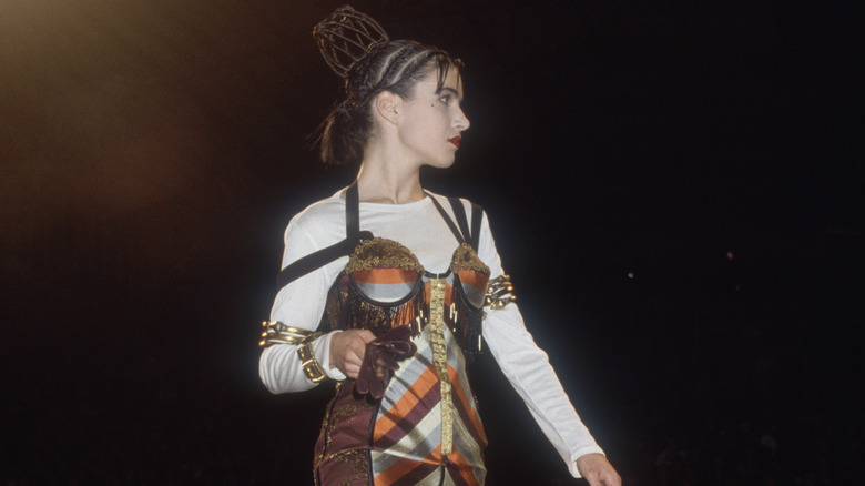 A woman wearing a bustier top