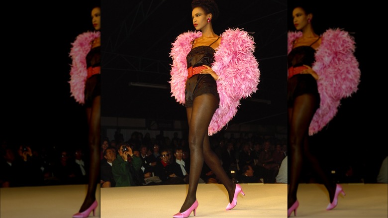 A model wearing feathers in the '80s
