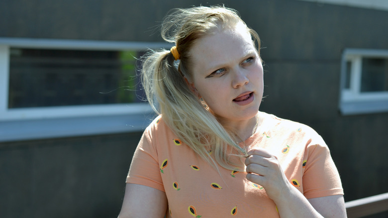 A woman with a side ponytail