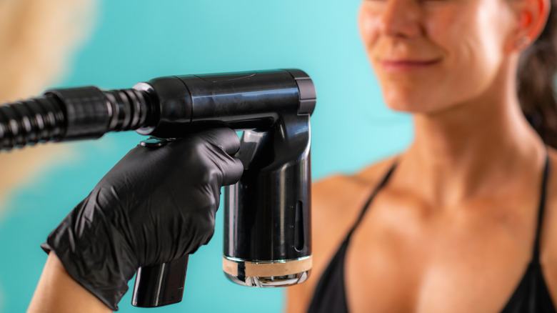 Person applying spray tan