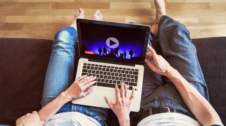 couple watching live concert from home
