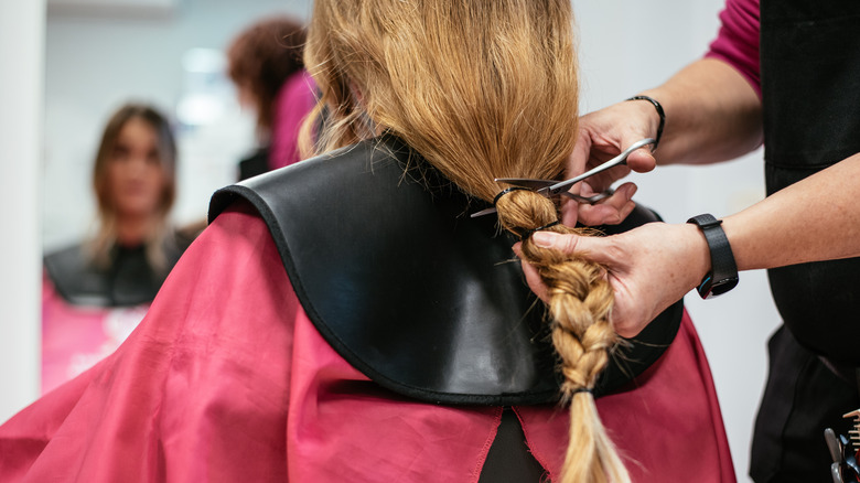 woman getting hair cut