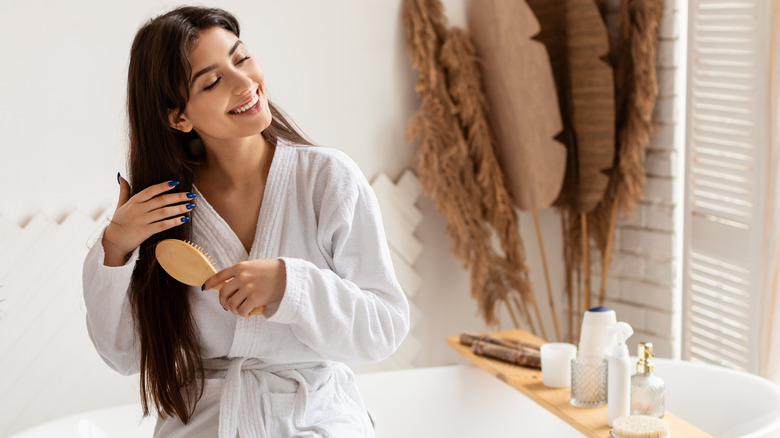 woman brushing long hair