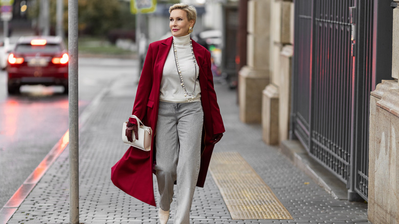 A woman wearing a red coat.
