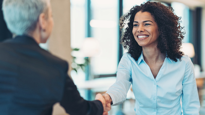 women shaking hands